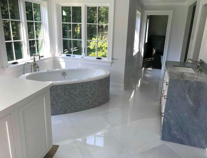 Tile Installation on a countertop, tub wall, and bathroom flooring